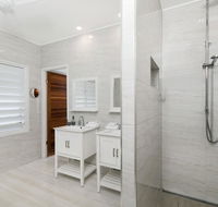 Bathers across the bay from Port Douglas - Accommodation in Brisbane